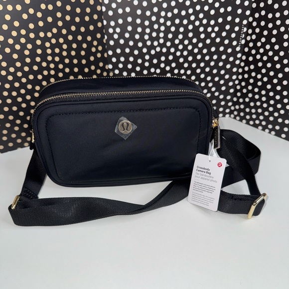 lululemon athletica Handbags - Lululemon Crossbody Camera Bag in Black and Gold